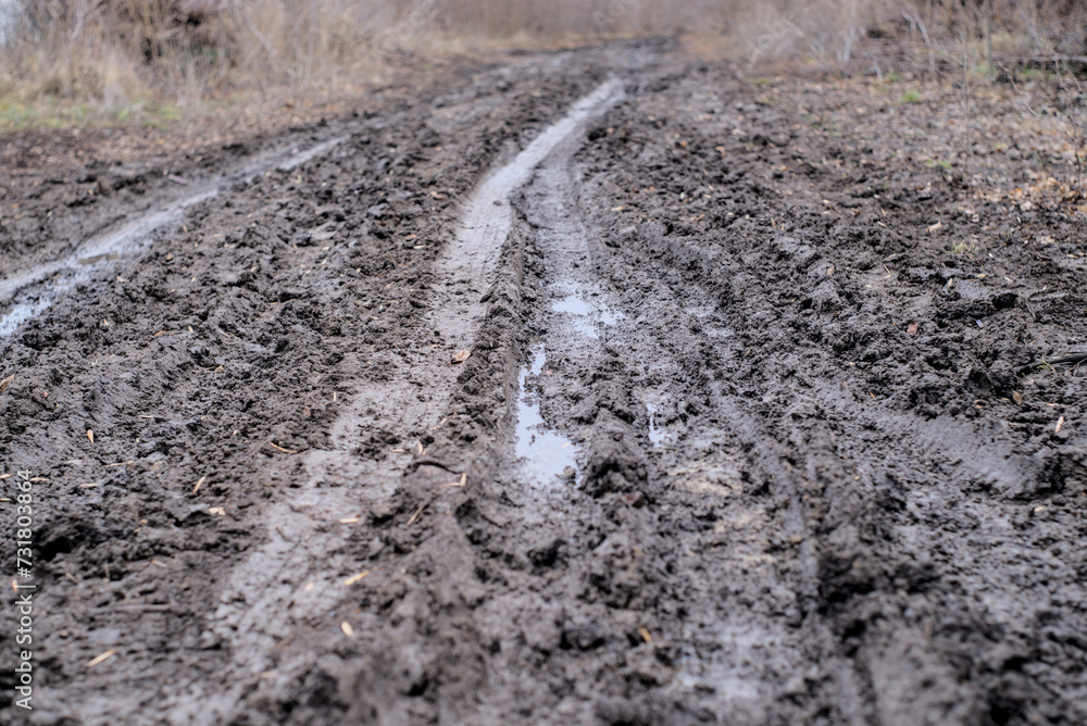 Wet muddy country road in February Wet muddy country road in February