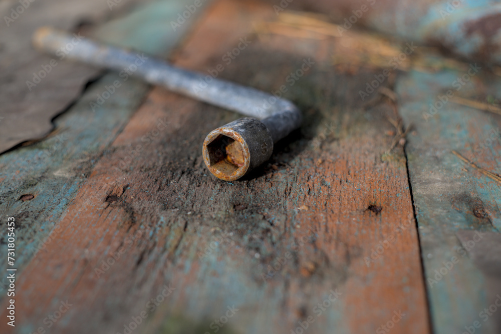 Old wrench isolated on the wood Old wrench isolated on the wood