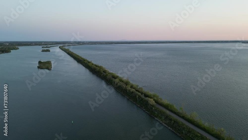 Wallpaper Mural Drone view over a road between trees located in the middle of a lake Torontodigital.ca