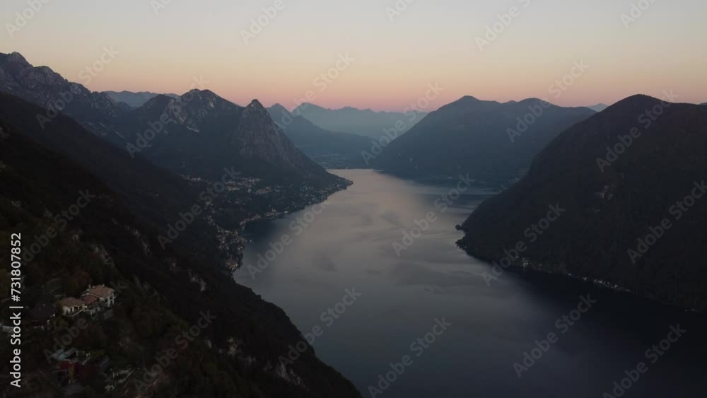 Drone view over a river between hills during sunset Drone view over a river between hills during sunset