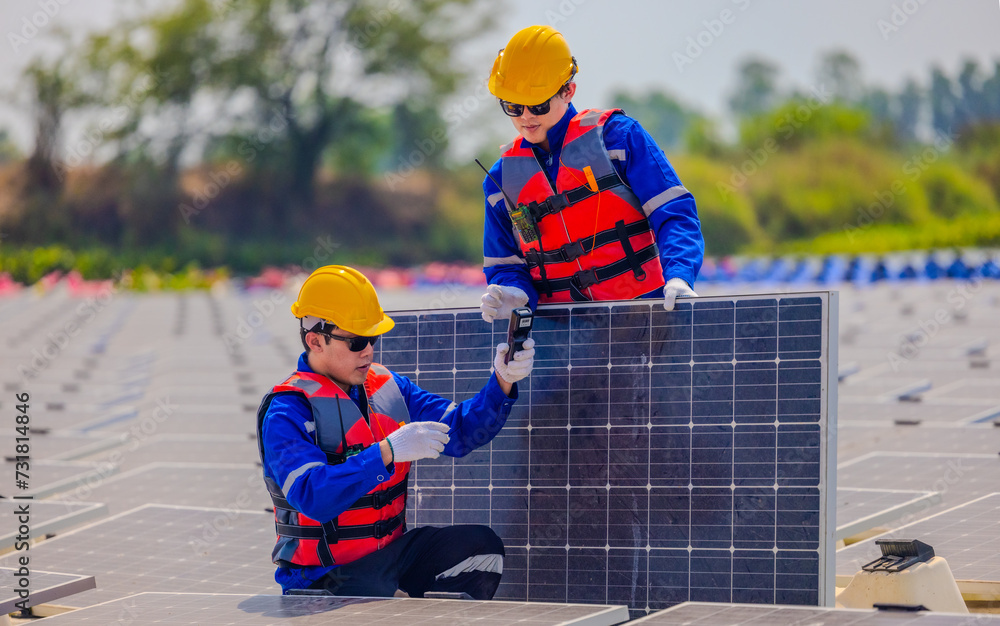 Technicians check floating solar farm wiring, polarity, and grounding for reliability and safety Technicians check floating solar farm wiring, polarity, and grounding for reliability and safety