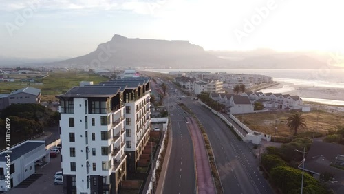 Drone Shot of a Building with Table Mountain in the Background 3