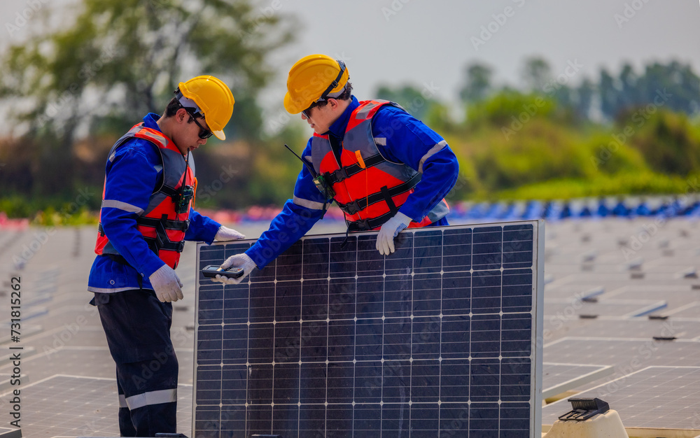 Technicians check floating solar farm wiring, polarity, and grounding for reliability and safety Technicians check floating solar farm wiring, polarity, and grounding for reliability and safety