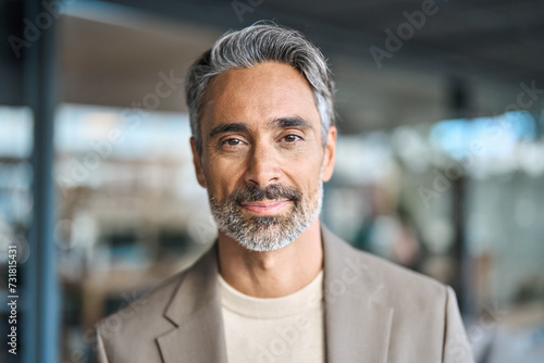 Close up headshot portrait of happy middle aged older professional business man, smiling bearded mature executive ceo manager, older male entrepreneur, rich confident business owner in office. photo
