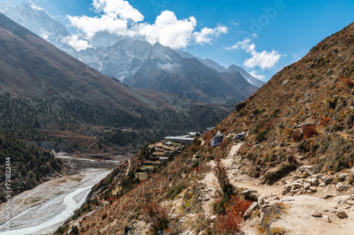 View of the Himalayas and river Imja Khola. View of mountains and stream during trekking from Dingboche to Pangboche in Sagarmatha, Nepal in a clear day. Three passes trek or Everest Base Camp EBC. photo