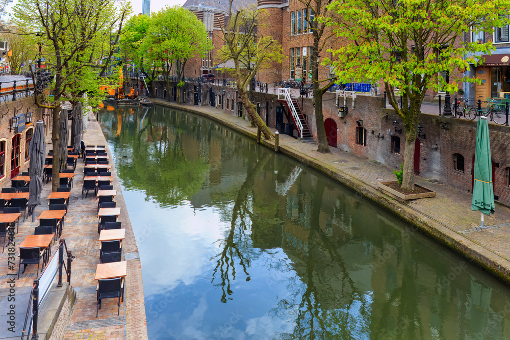 Utrecht iconic split level canal  in the  heart of the historic city in early morning - a vibrant slice of Dutch culture . Netherlands.