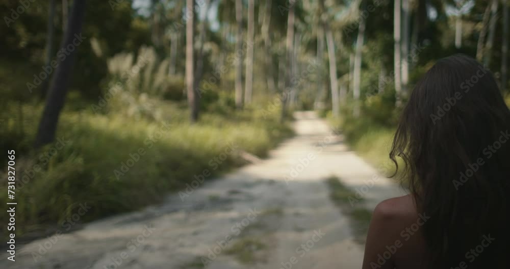Explore and relax in Thailand tropic island jungle forest. Female walk rural trail among coconut palm trees plantation garden. Exotic landscape. Outdoor lifestyle travel on summer holiday vacation. Explore and relax in Thailand tropic island jungle forest. Female walk rural trail among coconut palm trees plantation garden. Exotic landscape. Outdoor lifestyle travel on summer holiday vacation.