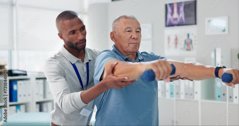 Dumbbells, physical therapy and old man with physiotherapist, muscle training and strength with senior care. Health, wellness and men at physio clinic for weightlifting, rehabilitation and equipment Dumbbells, physical therapy and old man with physiotherapist, muscle training and strength with senior care. Health, wellness and men at physio clinic for weightlifting, rehabilitation and equipment