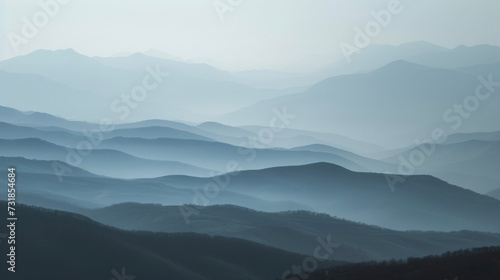 In the distance the mountains are ly visible through the mist giving a sense of depth and vastness to the landscape. © Justlight