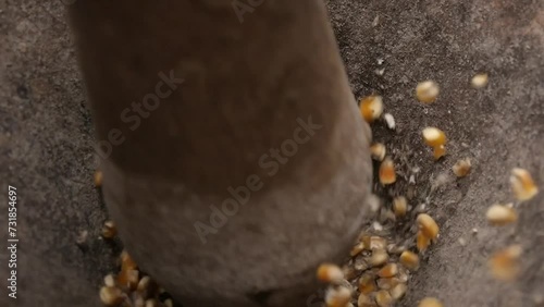 Rustic wooden pilon, handmade, used to grind corn in the traditional way in the fields of Latin America