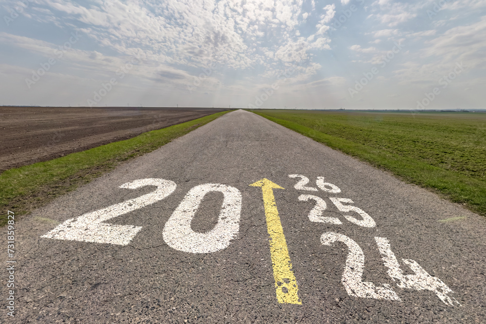 numbers 2025, 2024 and start on asphalt road highway with sunrise or sunset sky background. concept of destination in future, freedom, work start, run, planning, challenge, target, new year