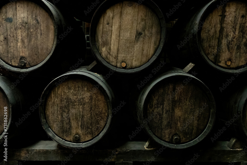 Wine casks at the winery. Stacked Wine barrels at the german winery. Old vintage whisky cask. old Single Malt