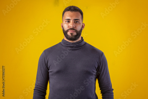 Man with beard wearing black shirt, with various facial expressions