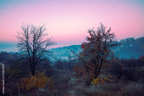Sunrise in the mountains in the early misty morning. Rural landscape. Obukhiv, Ukraine