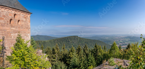 Mont Sainte Odile, France - 09 11 2020: Alsatian Vineyard. Panoramic view of the facade of the Sanctuary of Mont Sainte Odile and the forest along the wine route at sunrise.