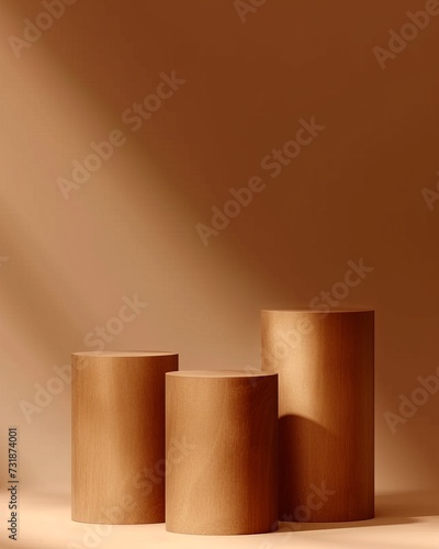 three wooden wooden cylinders on a brown background