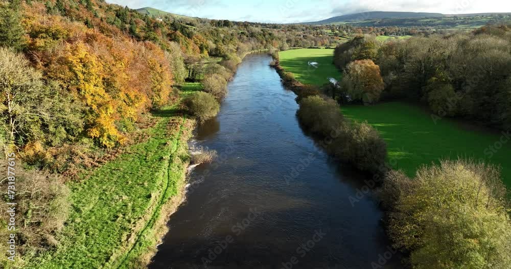 Flying on a river surrounded by autumn forest Flying on a river surrounded by autumn forest