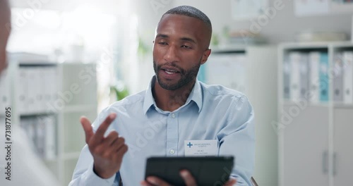 Black man, doctor and tablet with patient for consulting, diagnosis or steps in healthcare at hospital. Person or medical employee talking or explaining with technology in consultation for checklist photo