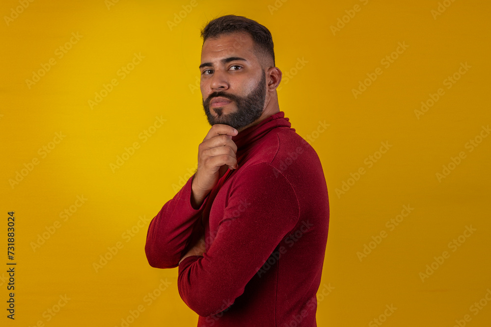 Adult man with beard wearing red long-sleeved shirt Adult man with beard wearing red long-sleeved shirt