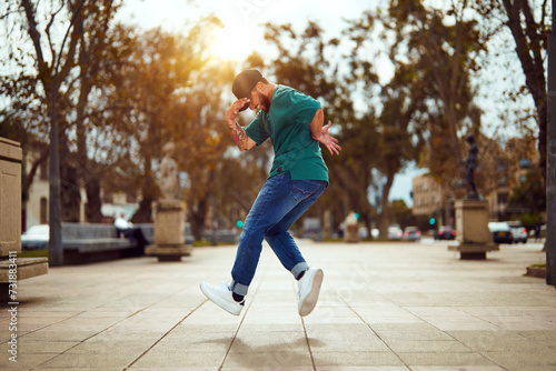 latin American breakdancer performing foot movements or toprock on the street
