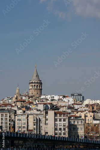 Galata Tower standing tall above Istanbul's cityscape on a sunny day.