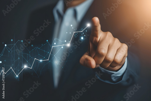 Businessman pointing growing graph, success and growth plan, development arrow