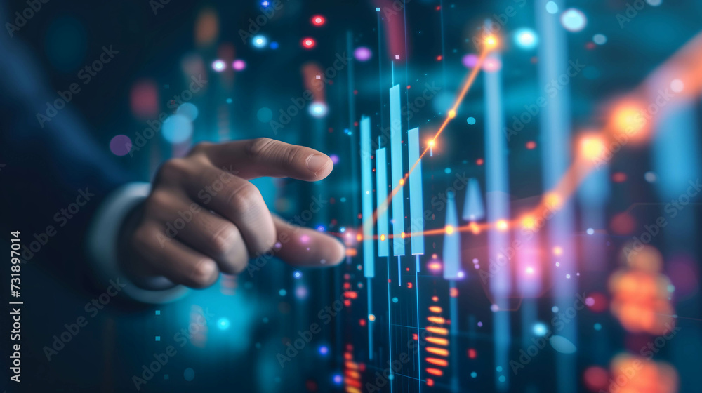 Hand of businessman or investor pointing to data, information, histogram, chart showing financial and business growth and make a plan to reach goal of success Hand of businessman or investor pointing to data, information, histogram, chart showing financial and business growth and make a plan to reach goal of success