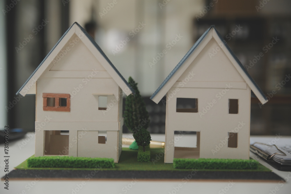 Business Signing a Contract Buy - sell house, insurance agent analyzing about home investment loan Real Estate concept. Business Signing a Contract Buy - sell house, insurance agent analyzing about home investment loan Real Estate concept.