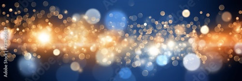 Golden light particle bokeh on dark blue background with gold foil texture holiday concept