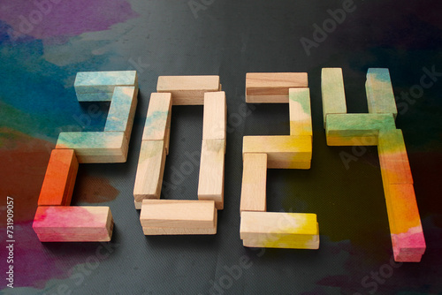 Happy New Year 2024 Idea. Transition from 2023 to new year 2024 concept with text on wooden blocks. Creative Concept. 