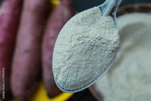 Close-up view of Sweet potato powder in a spoon 