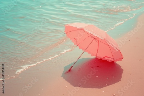 a pink parasol on sandy beach  minimal summer concept