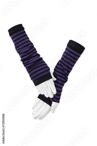 Close-up photo of a pair of striped fingerless gloves with thumbhole. Long black and purple glovelettes are isolated on a white background. Front view. photo