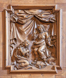 VARENNA, ITALY - JULY 20, 2022: The carved Annunciation in the church Chiesa di San Giorgio by unknown baroque artist.