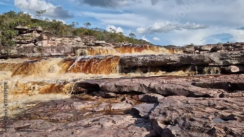The Tiburtino waterfall in Mucuge, in the Chapada Diamantina, in Bahia, Brazil running over rocks and stones.  Sempre Viva park photo