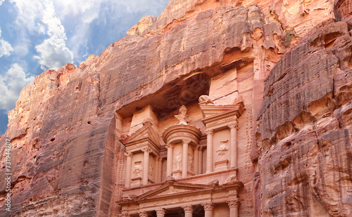 Al Khazneh or The Treasury (against the background of a beautiful sky with clouds). Petra, Jordan-- it is a symbol of Jordan, as well as Jordan's most-visited tourist attraction