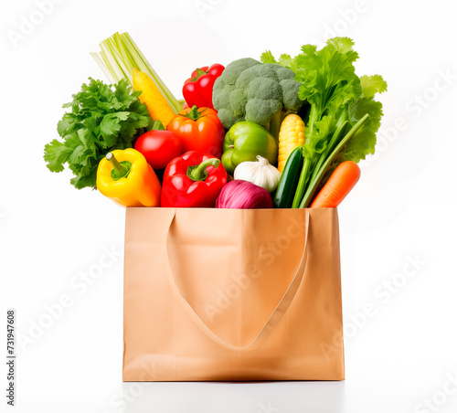 Paper bag with fresh vegetables isolated on white background