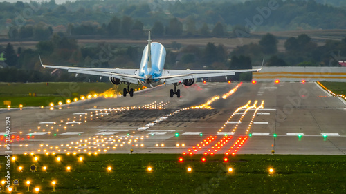 landing at the airport, landing on a runway, plane lands on a runway photo