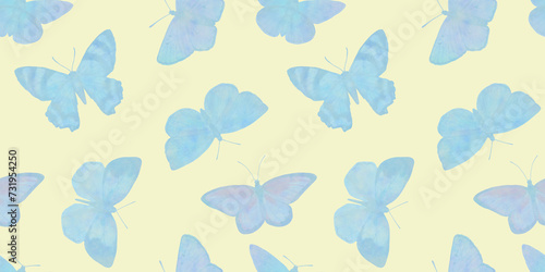 blue butterflies isolated on a light green background. © Sergei