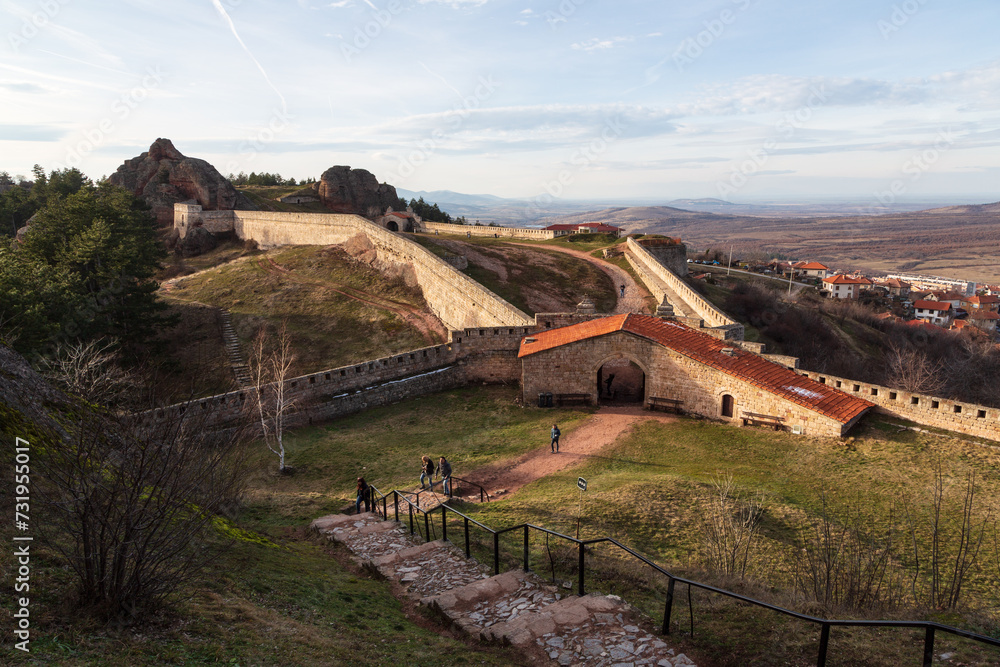 Obraz premium A scenic landscape of the Belogradchik Rocks in Bulgaria with impressive rock formations with amazing light at golden hour in winter. Belogradchik, Bulgaria