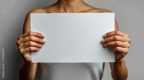 Hands holding blank paper - mockup (ID: 731958229)
