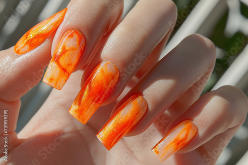 Manicure closeup. Woman orange nails close-up. Nail care in beauty salon. Spa healthy treatments for female hands. Fashion bright summer trendy manicure.