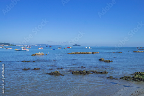 Penha-sc,brazil, beach of Trapiche with fishing boats in the background and mountains