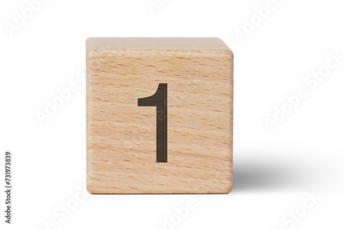 A single wooden block prominently displays a black number one, isolated cutout from background. photo