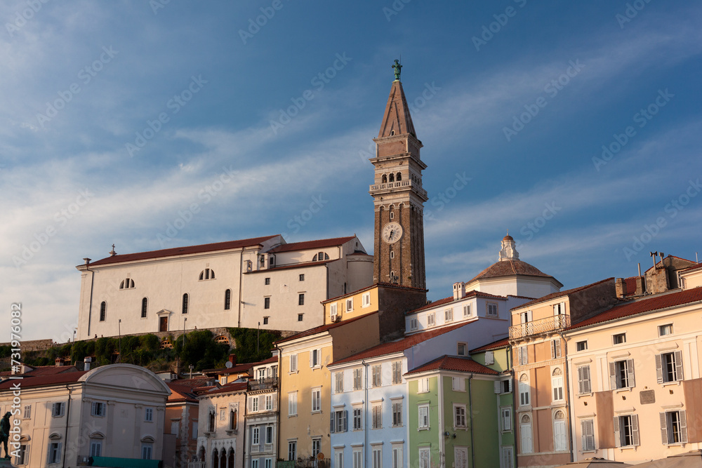 Free standing bell tower of Cathedral of St. Georges between houses, Piran