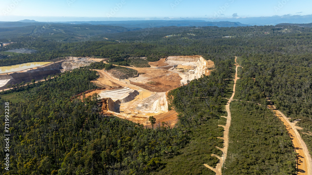 Drone aerial photograph of an industrial quarry in a large forest in regional Australia