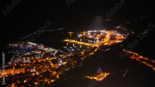 drone: vista notturna su Piazza della LIbertà, porto, lungomare e castello Arechi. Salerno, Italia.
Evento con palco in piazza photo