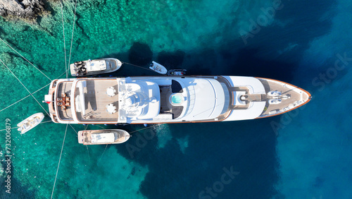 Aerial drone top down photo with copy space of luxury yacht anchored in tropical exotic island with crystal clear turquoise sea © aerial-drone