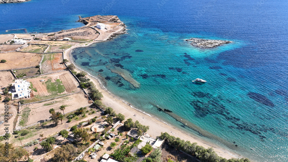 Aerial drone photo of paradise beach of Tsigouri and heart shaped small islet of Plaka, Schoinousa, Small Cyclades, Greece