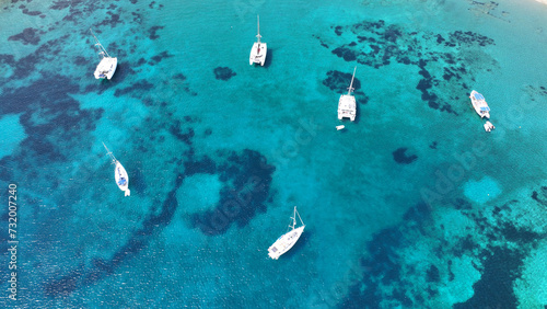 Aerial drone photo of sail boats anchored in paradise island of Paxos, Ionian sea, Greece